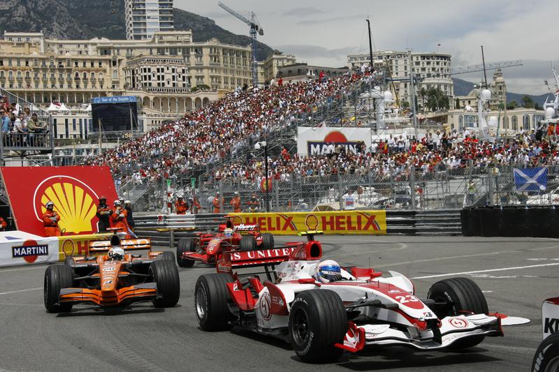 Formula 1 cars sliding cornering the famous Monaco Grand Prix.